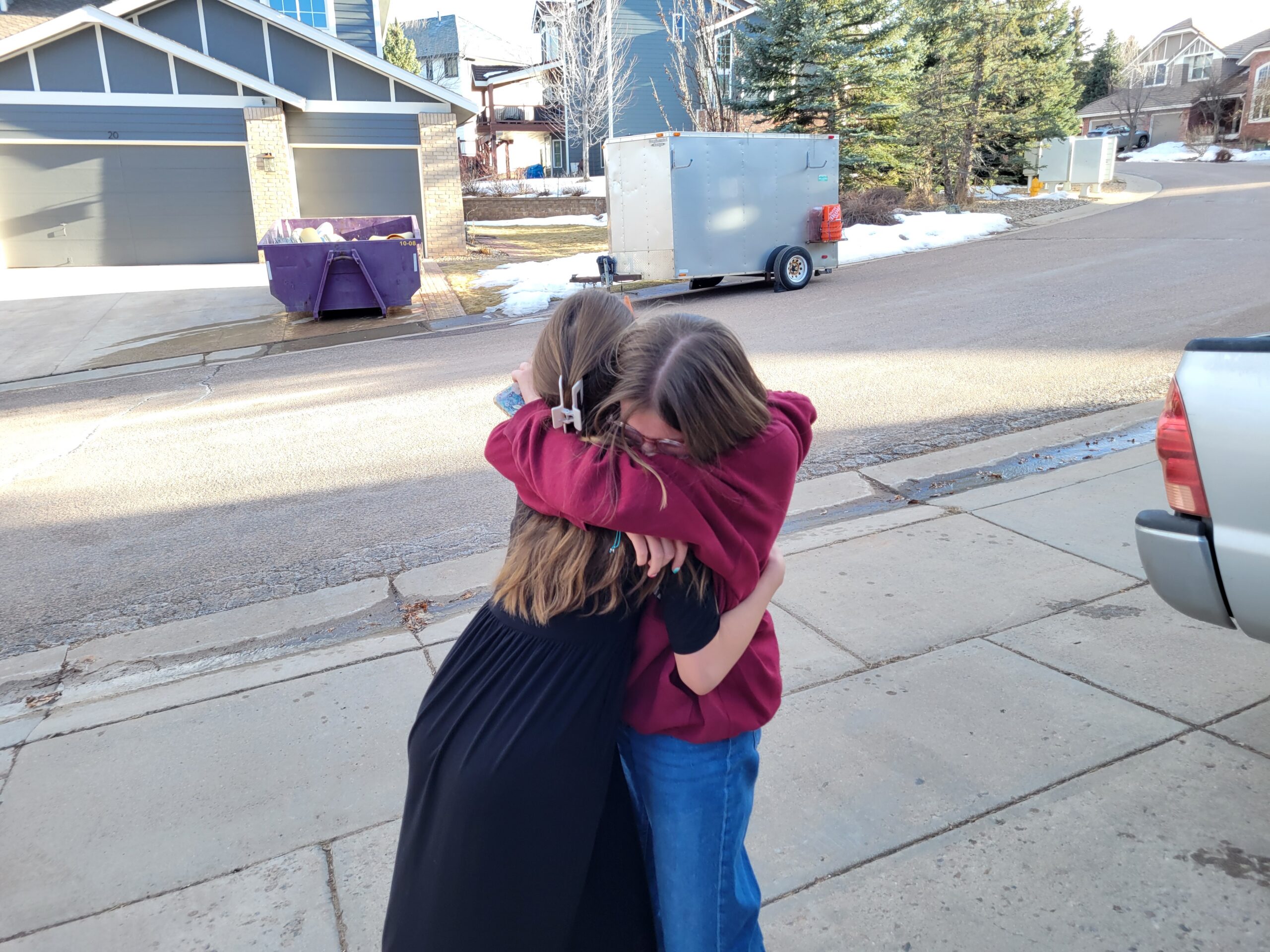 Two friends hugging
