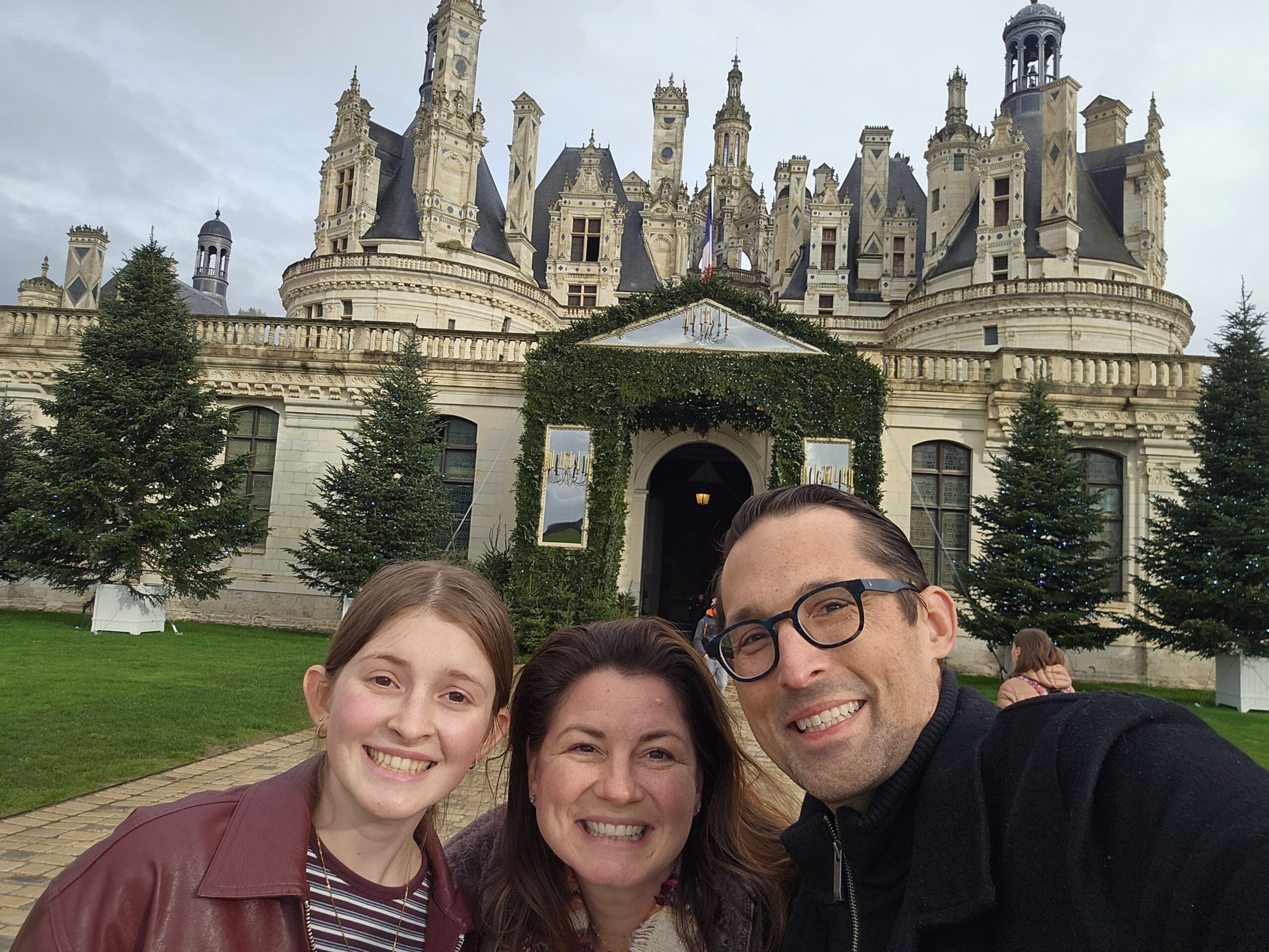 Family in front of a castle in France